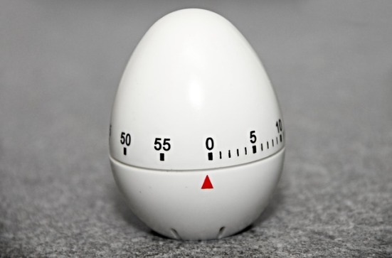 A kitchen egg timer set at zero