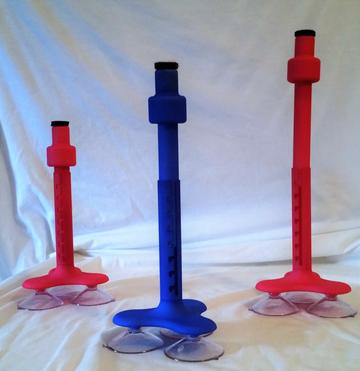 Three devices that are telescoping mounted rods topped with a pivoting magnet. The rods mount via a suction-cup base.