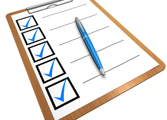 A clipboard with a checklist and pen